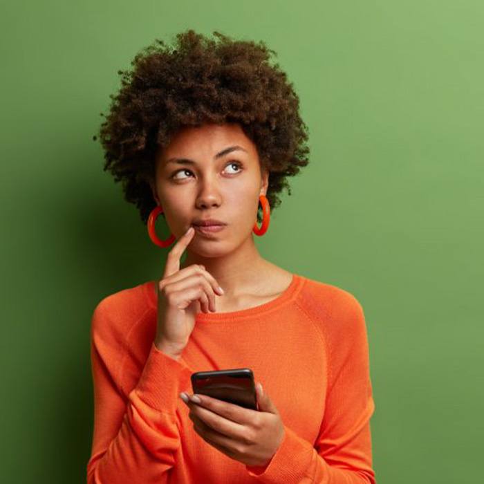 Doctor Lundgren holding an Invisalign kit